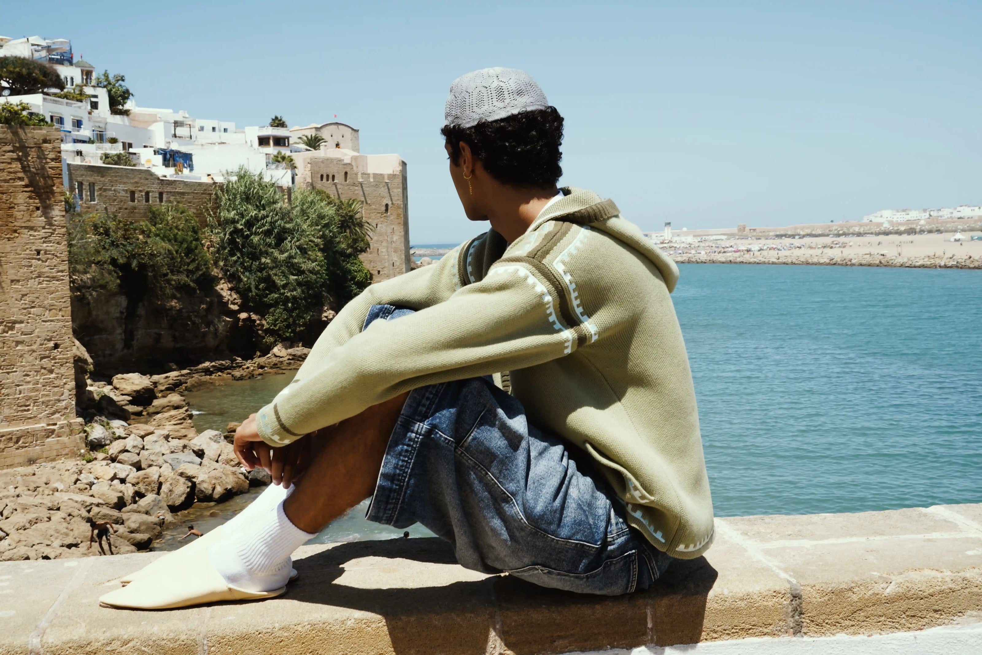 R'MILI Berbere Knitwear Jacket in green, Rabat backdrop