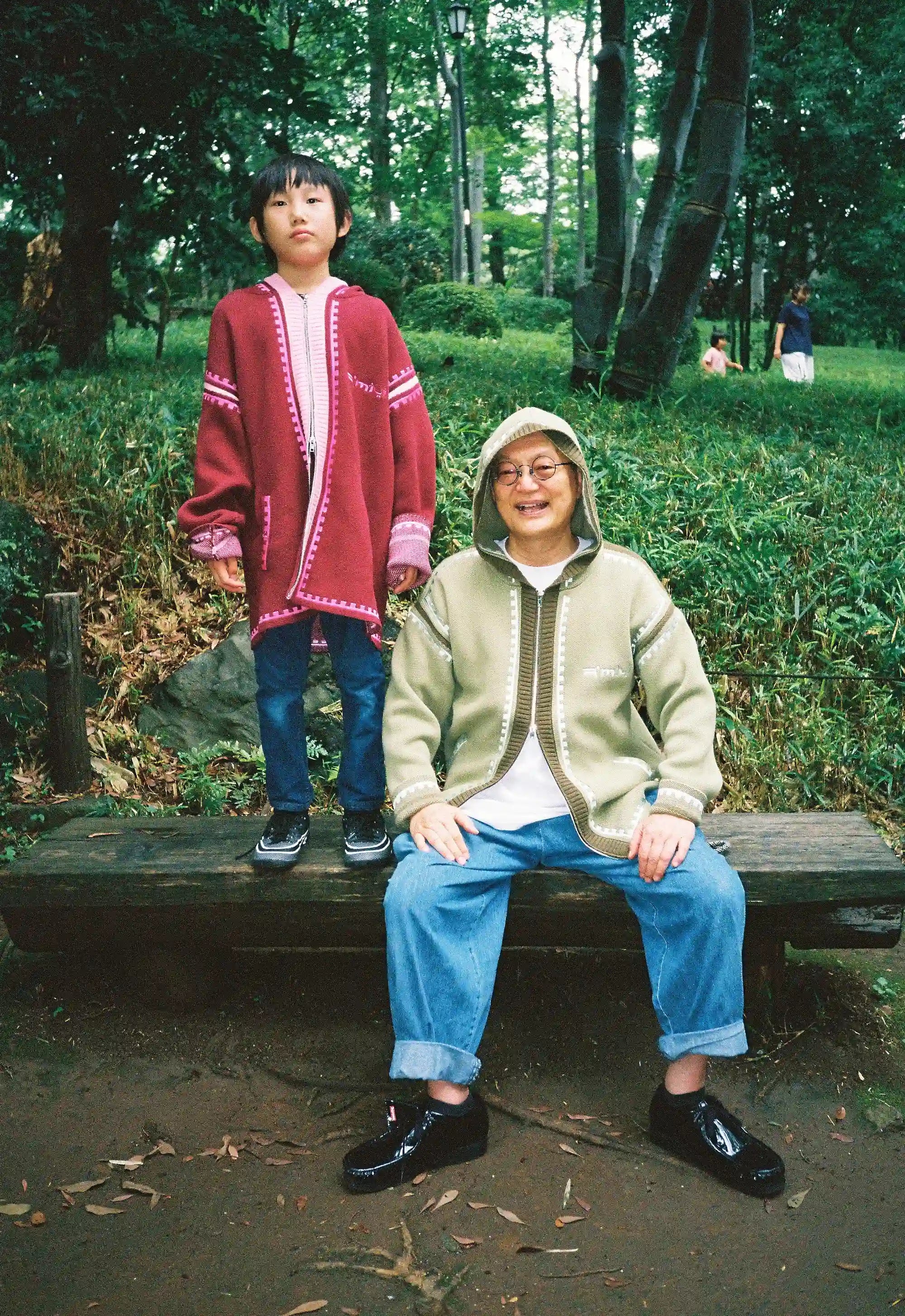 Masahiro and Kantaro wearing R'MILI Berbere Knitwear Jacket in burgundy and green, Tokyo 