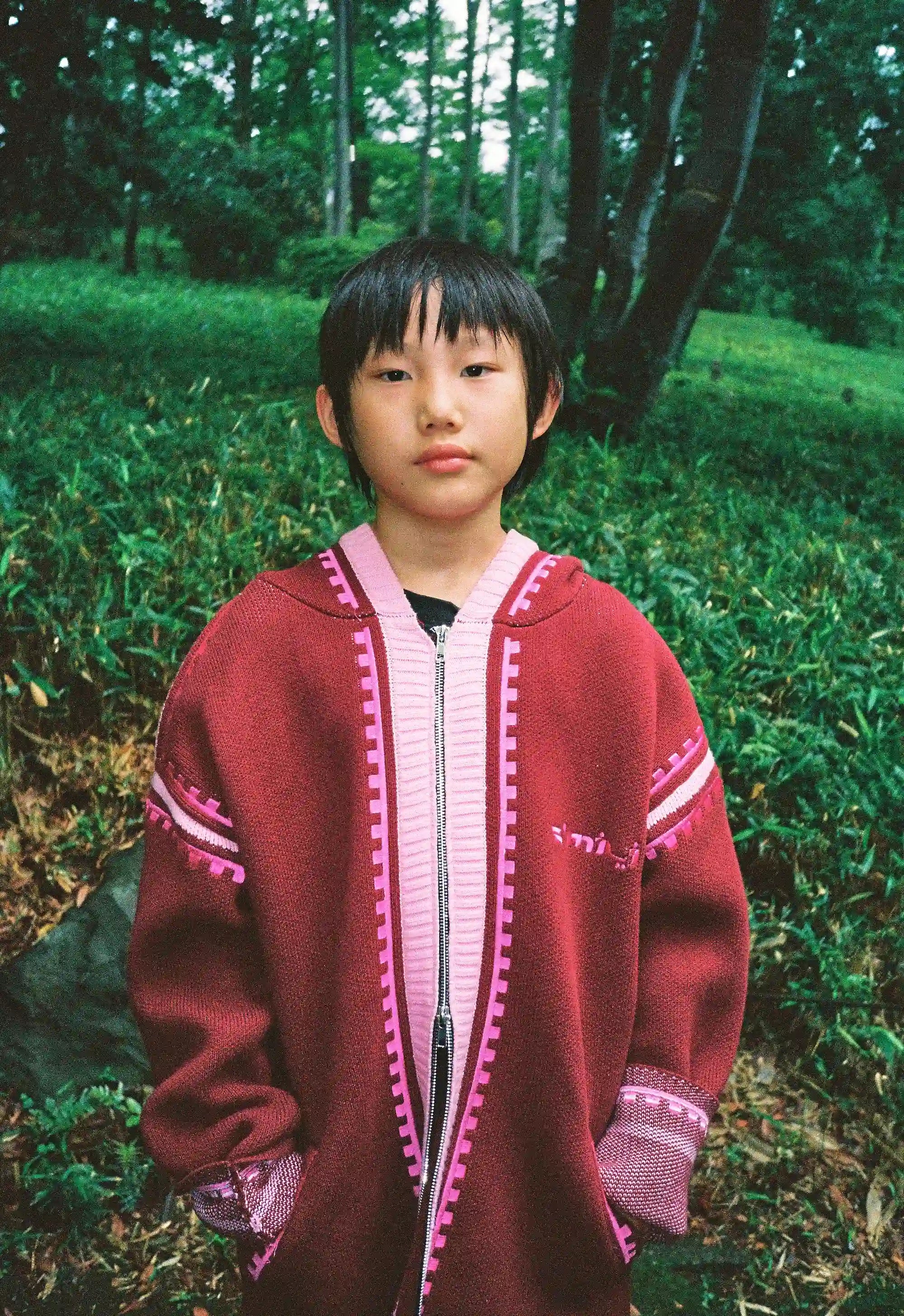 Kantaro wearing R'mili Berbere Knitwear Jacket in burgundy, Tokyo 